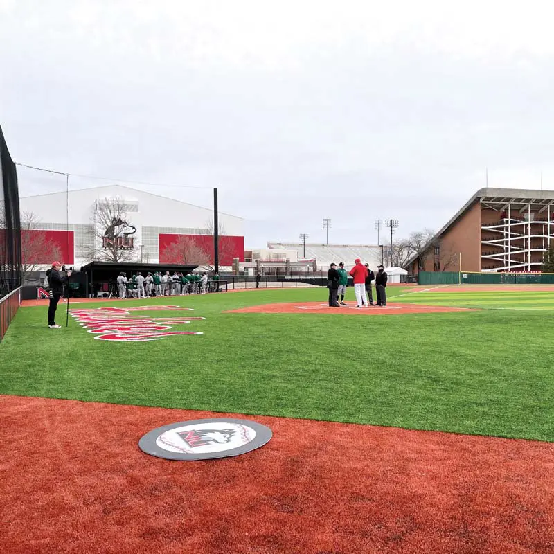 people standing on the baseball field